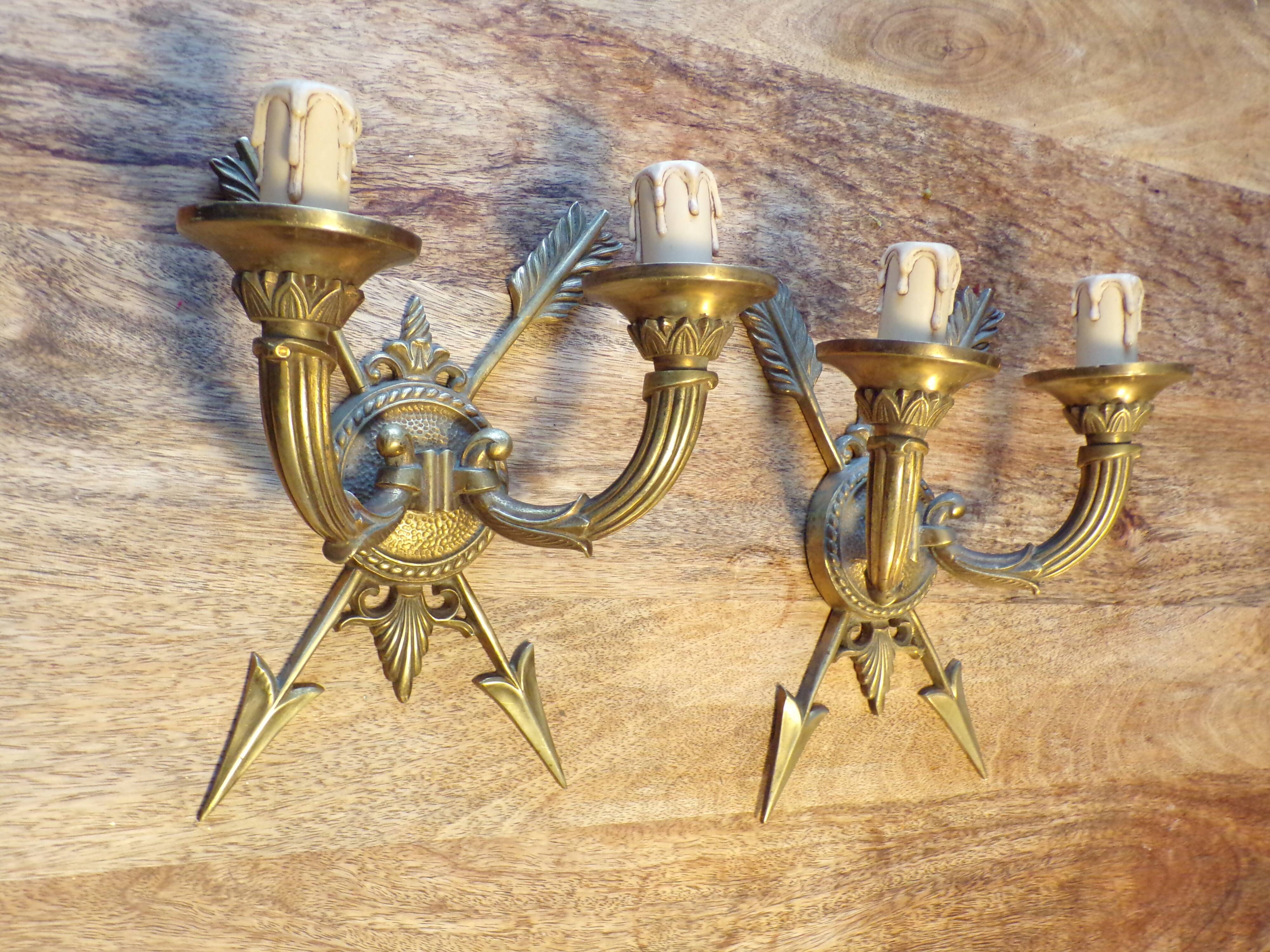 Pair of empire style bronze arrow wall lights