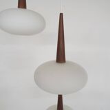 Set of three milk glass and teak pendant lights model NG74 by Louis Kalff for Philips, The Netherlan