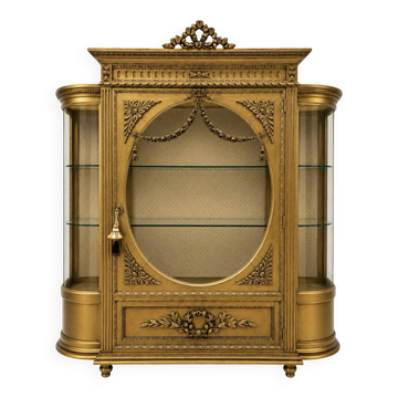 French antique Louis XVI display cabinet in gilded wood with curved glass sides.