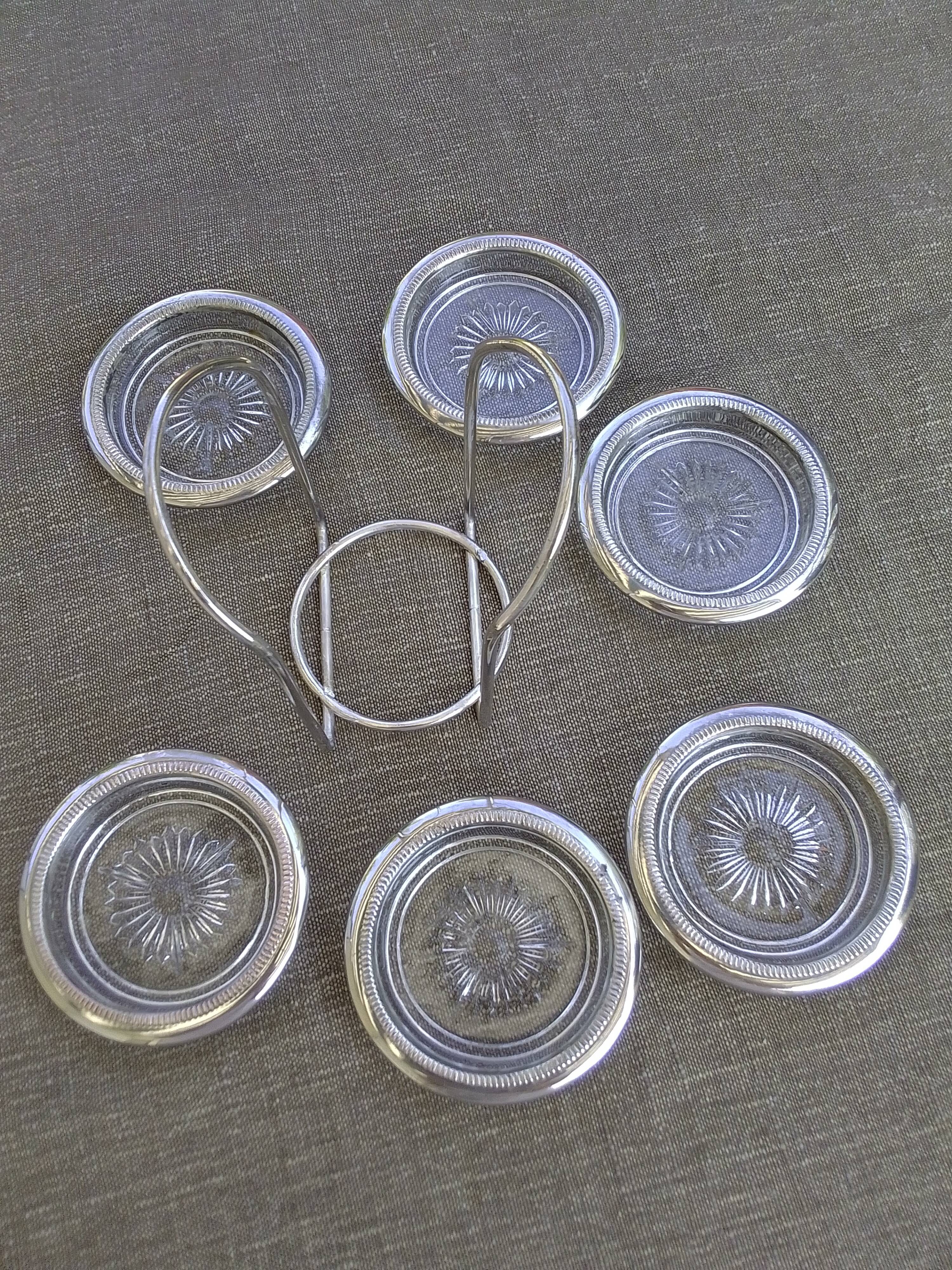 6 coasters and silver metal support