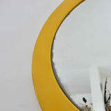 Round wall mounted mirror in yellow plastic 1970