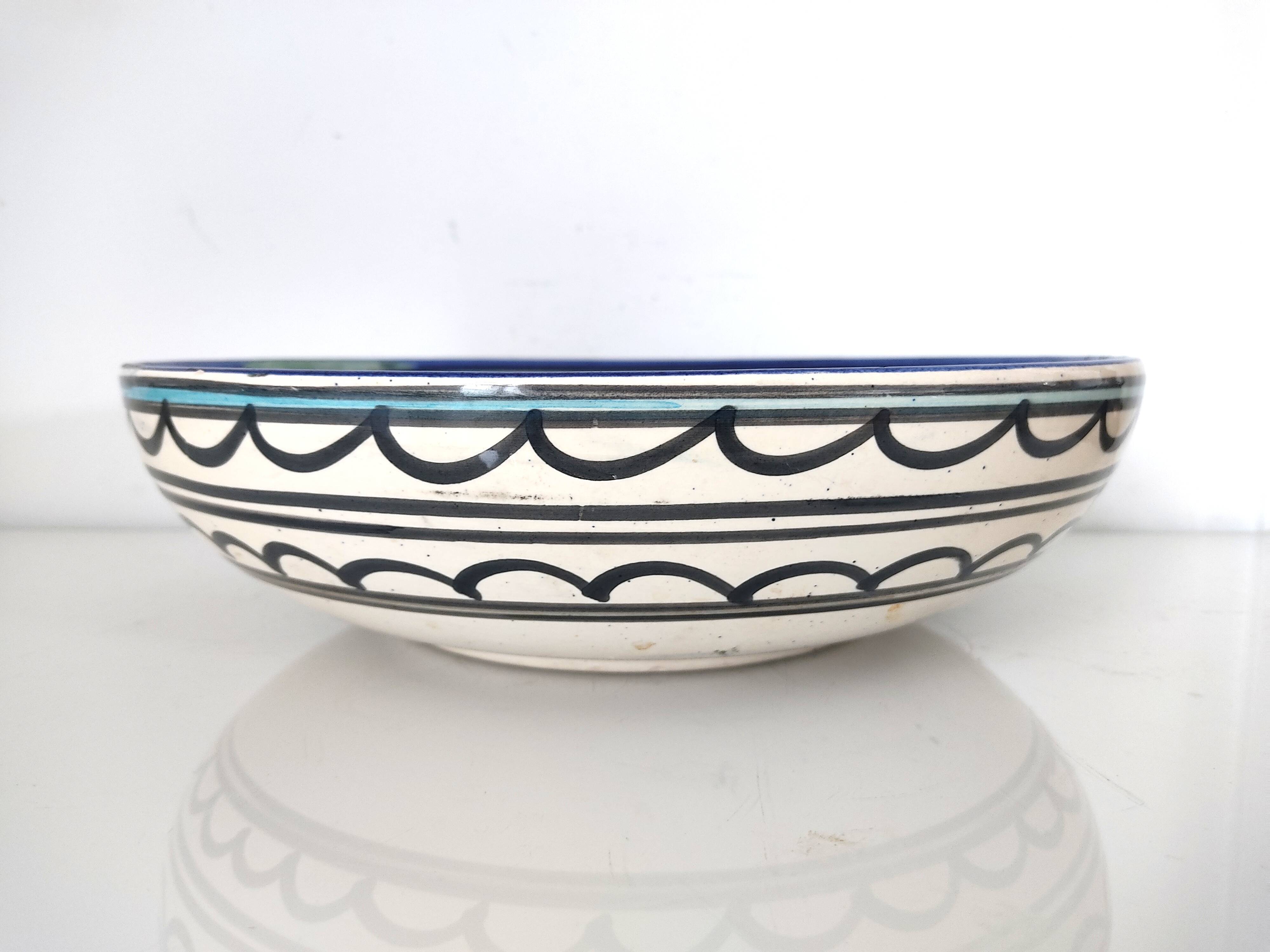 Large decorative dish with colorful peacock