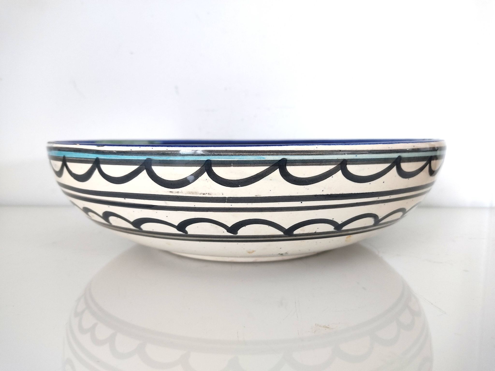 Large decorative dish with colorful peacock