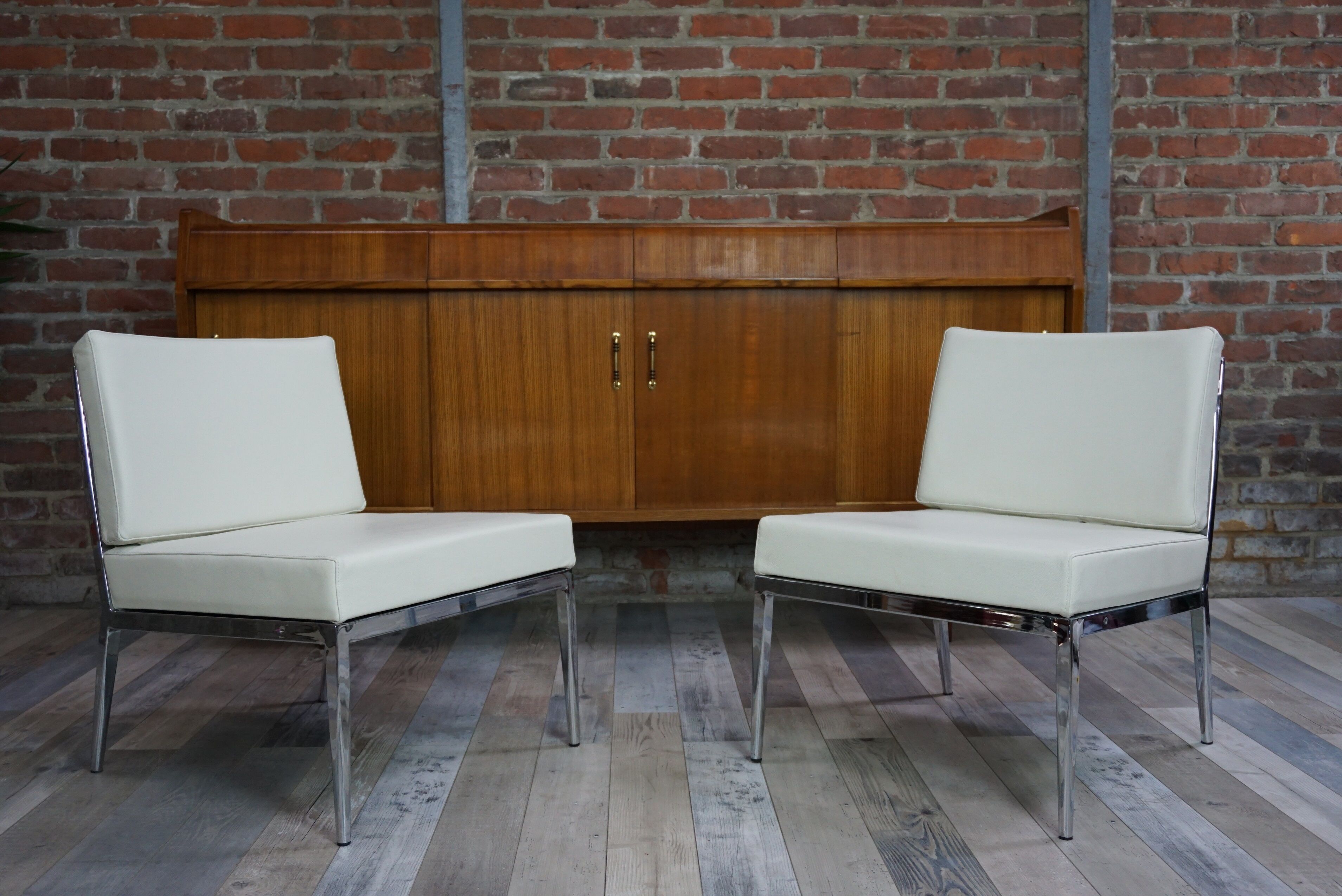 Pair of chrome and leather armchairs