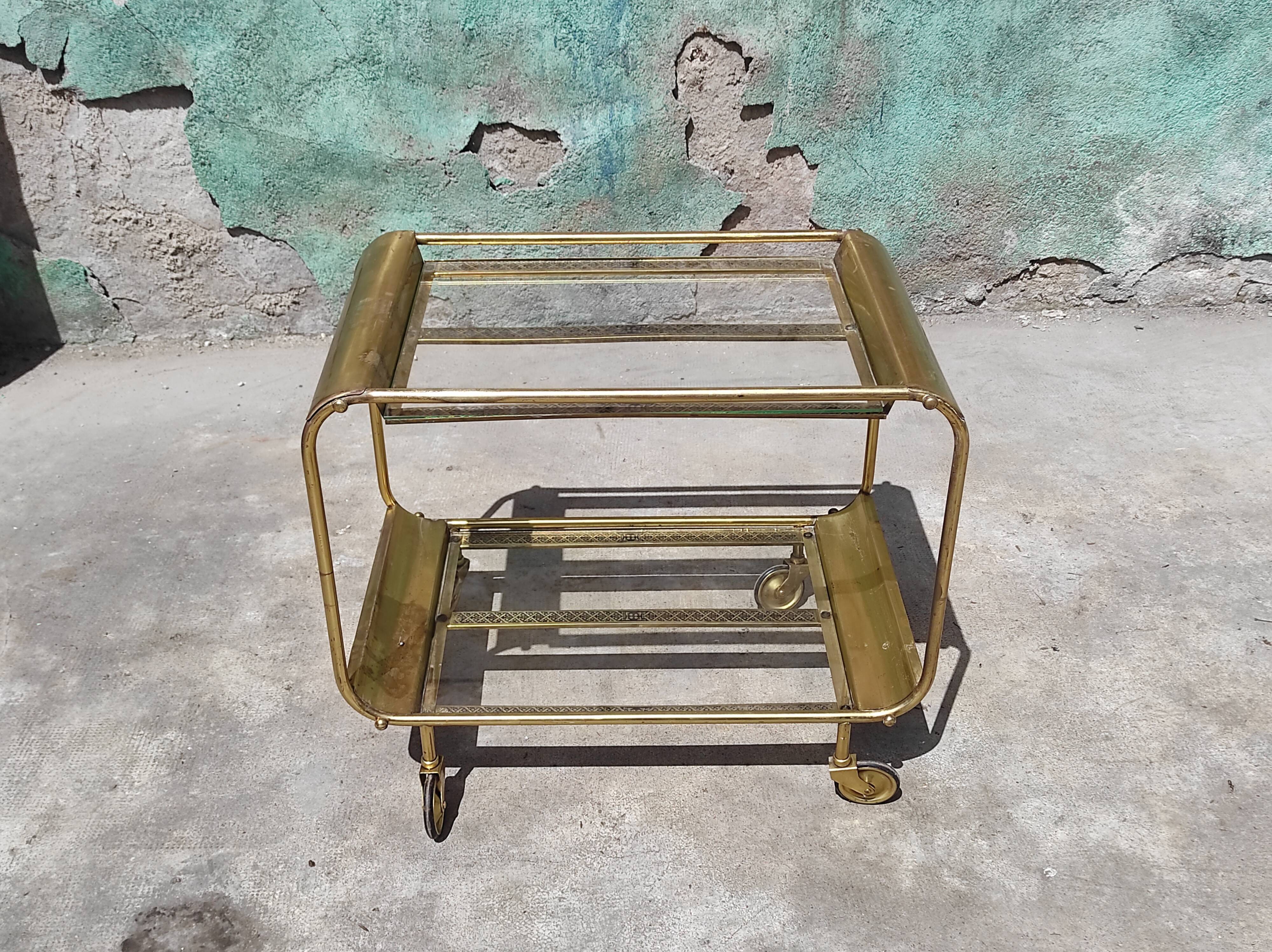 Old rolling coffee table serving vintage brass bar 50s mid-century design