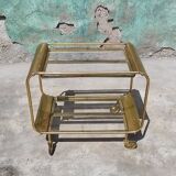 Old rolling coffee table serving vintage brass bar 50s mid-century design