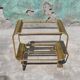 Old rolling coffee table serving vintage brass bar 50s mid-century design