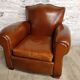 Club chair with a moustache backrest