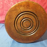Wooden milking stool with twisted legs