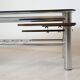 Chrome metal coffee table with smoked glass top.