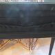 Vintage planter on wheels made of oak, repainted in black.