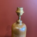 "Stoneware Bottle Lamp" with a multicoloured blue lampshade handwoven in India.