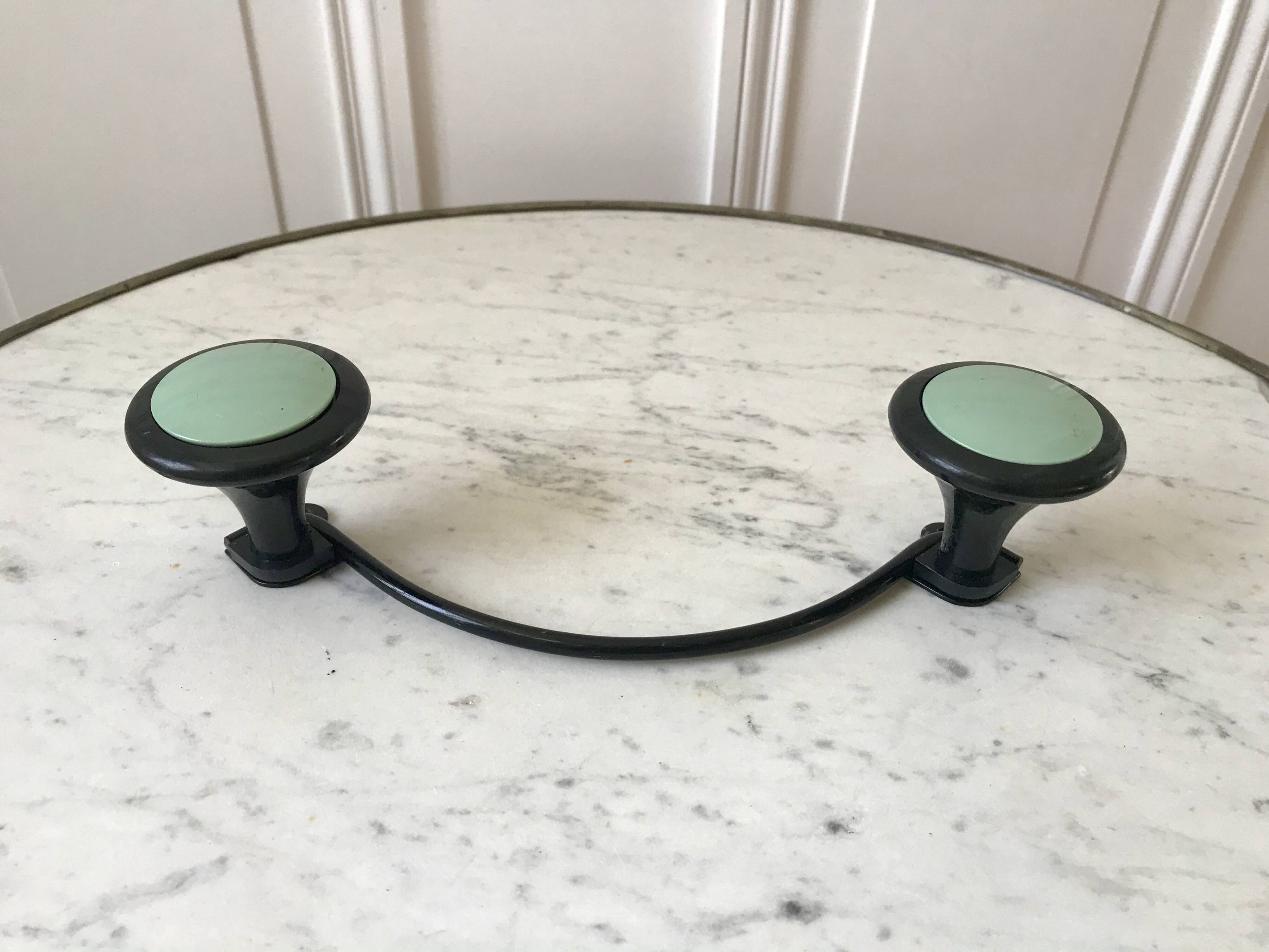 Design coat hook in sage green and black metal from the 70s