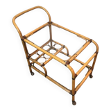 Rolling table made of rattan and leather straps