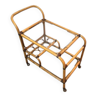 Rolling table made of rattan and leather straps