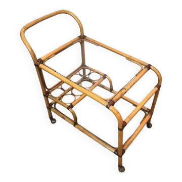 Rolling table made of rattan and leather straps