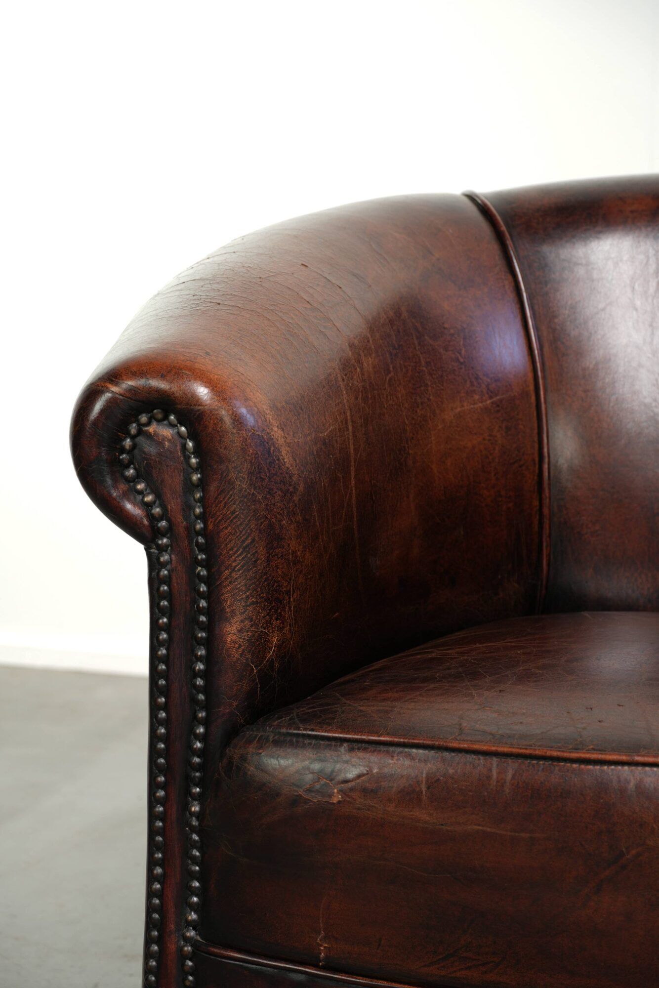 Vintage sheepskin club armchair with beautiful colours and a subtle size