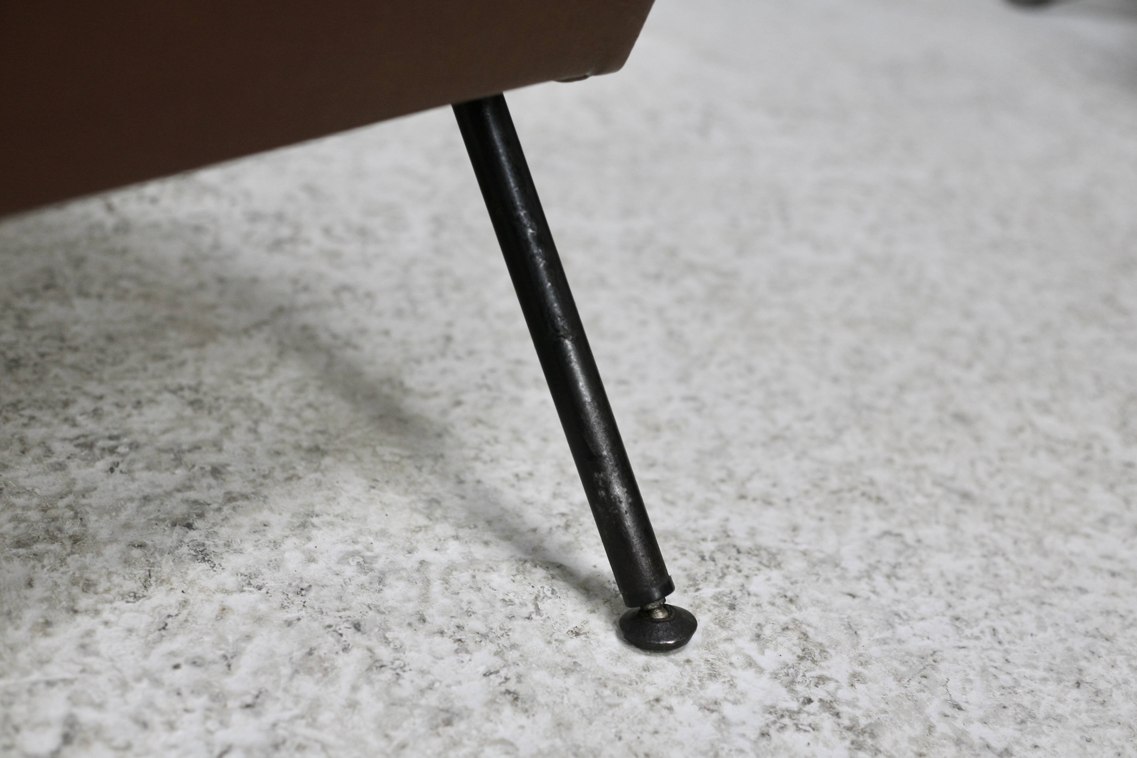 Low chair, circa 1950. Brown imitation leather.