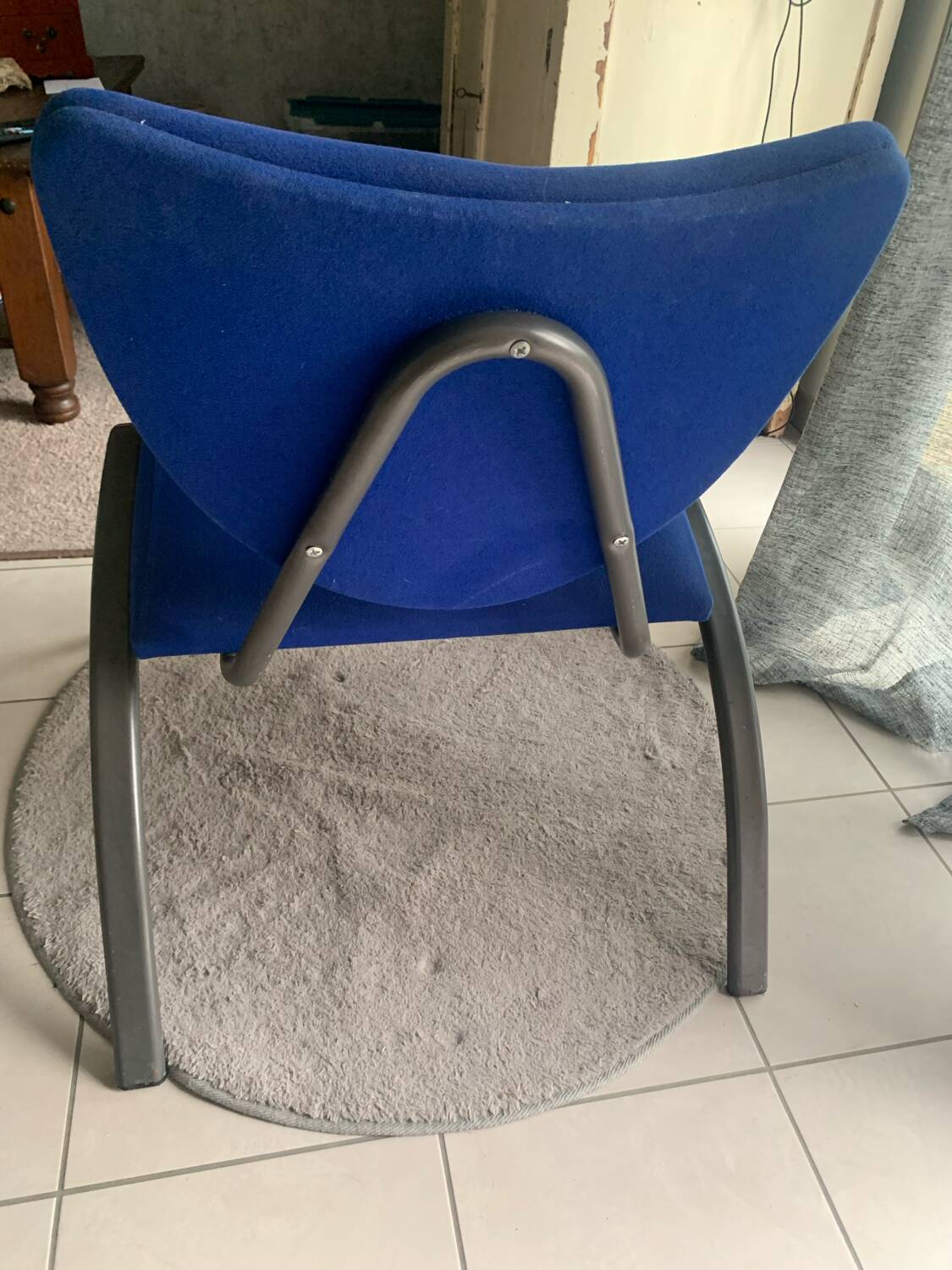 Black metal design armchair with blue fabric. 1980s.