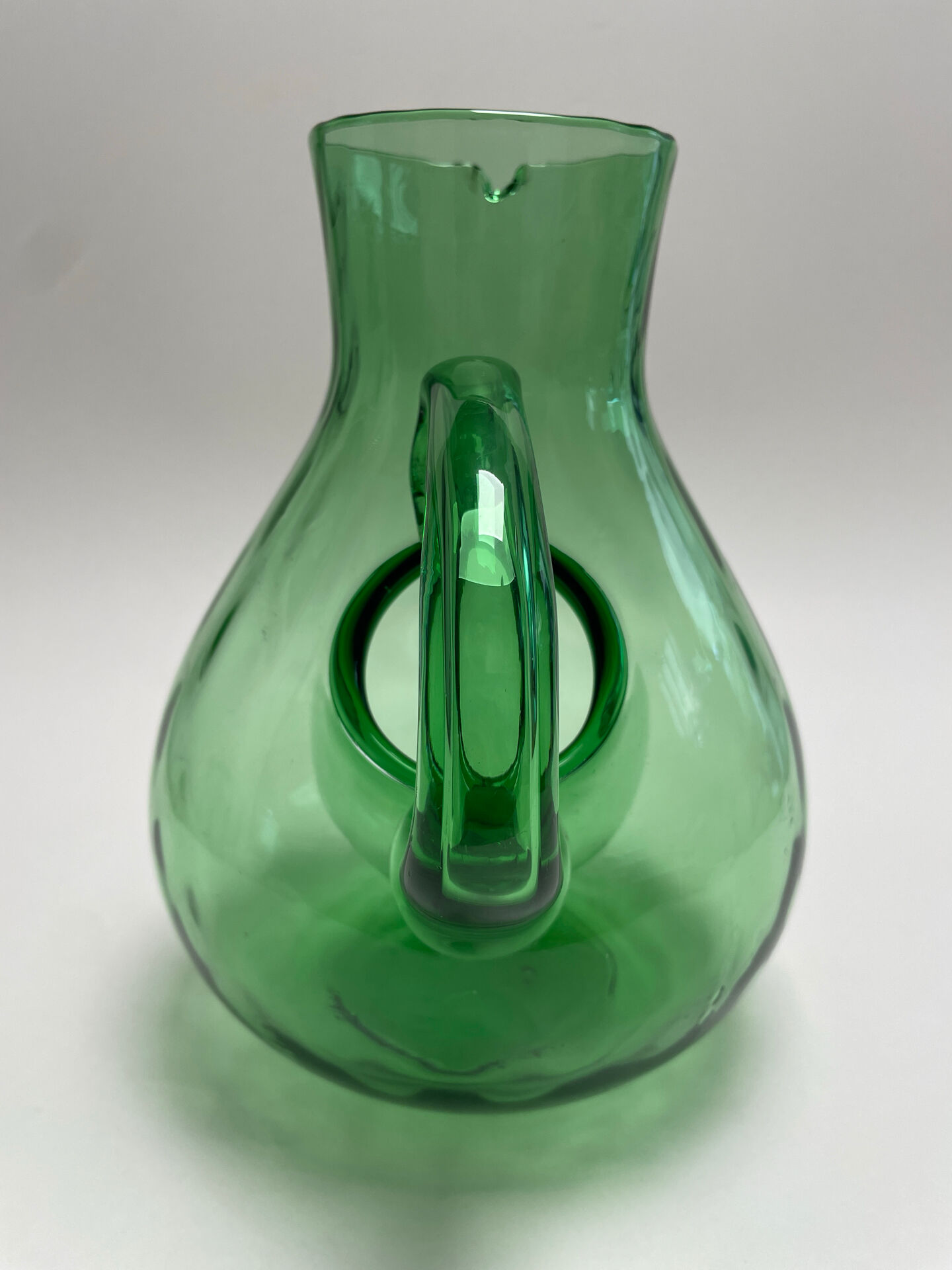 Large green glass cooling jug