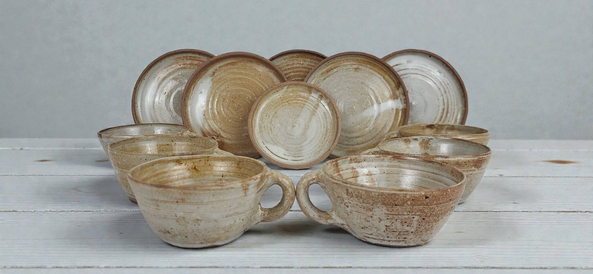 6 stoneware cups and saucers by Pierre Lion