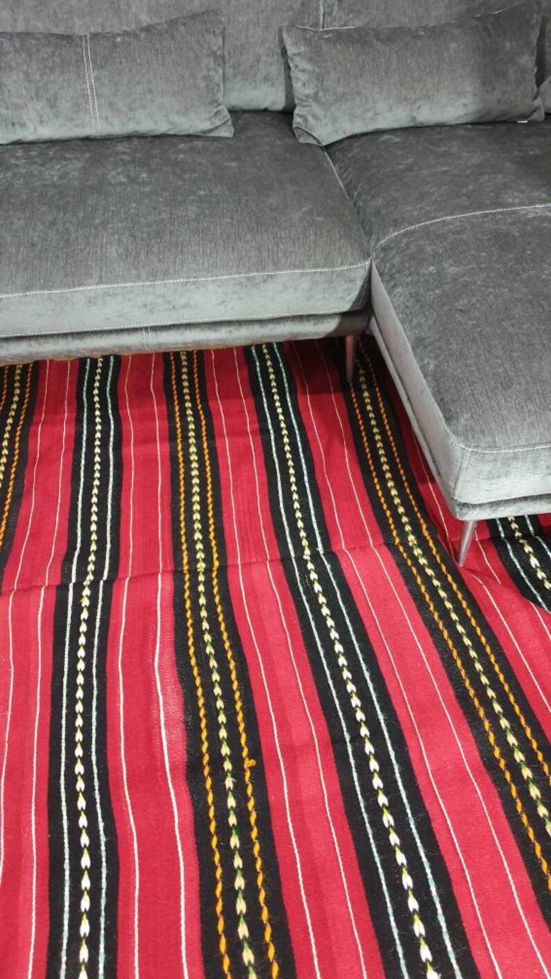 Hand-woven red wool rug