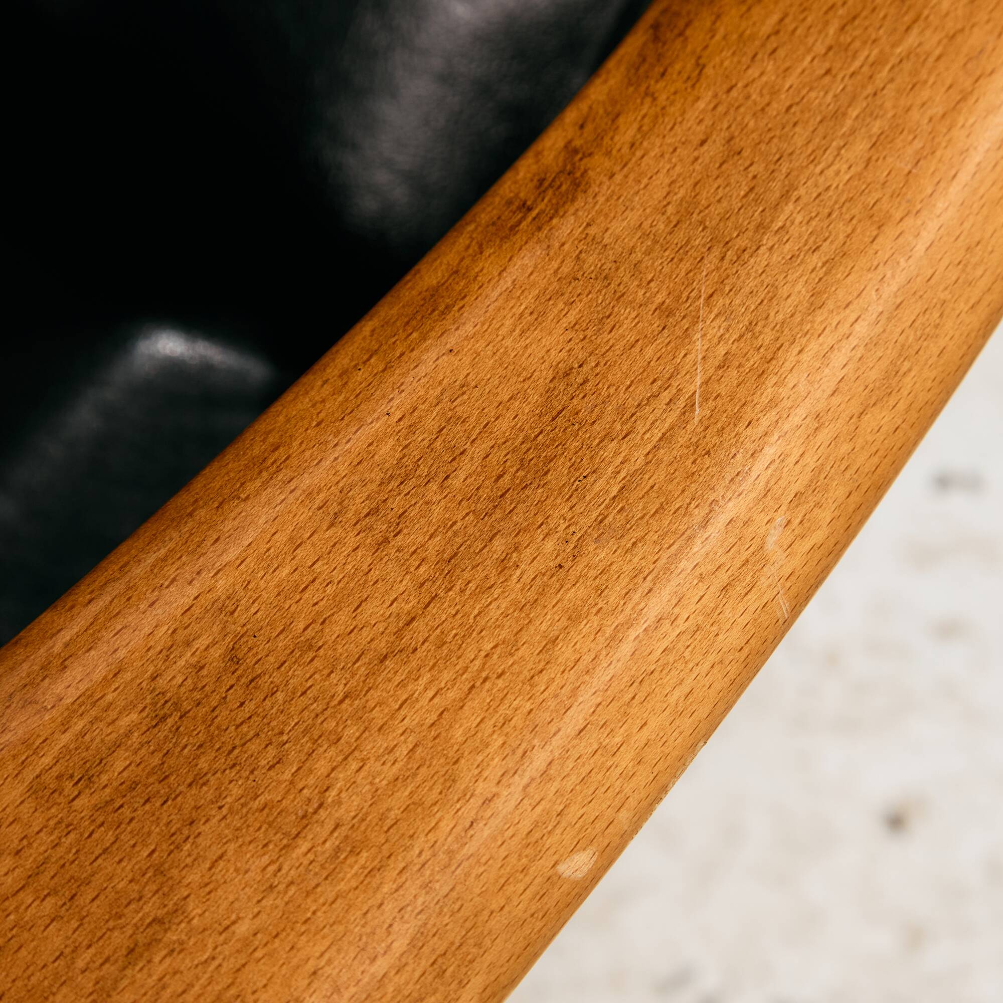 Beech armchair with leather upholstery