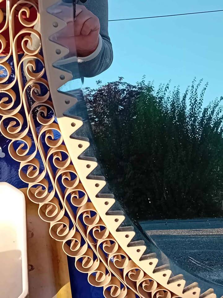 Engraved mirror surrounded by metal