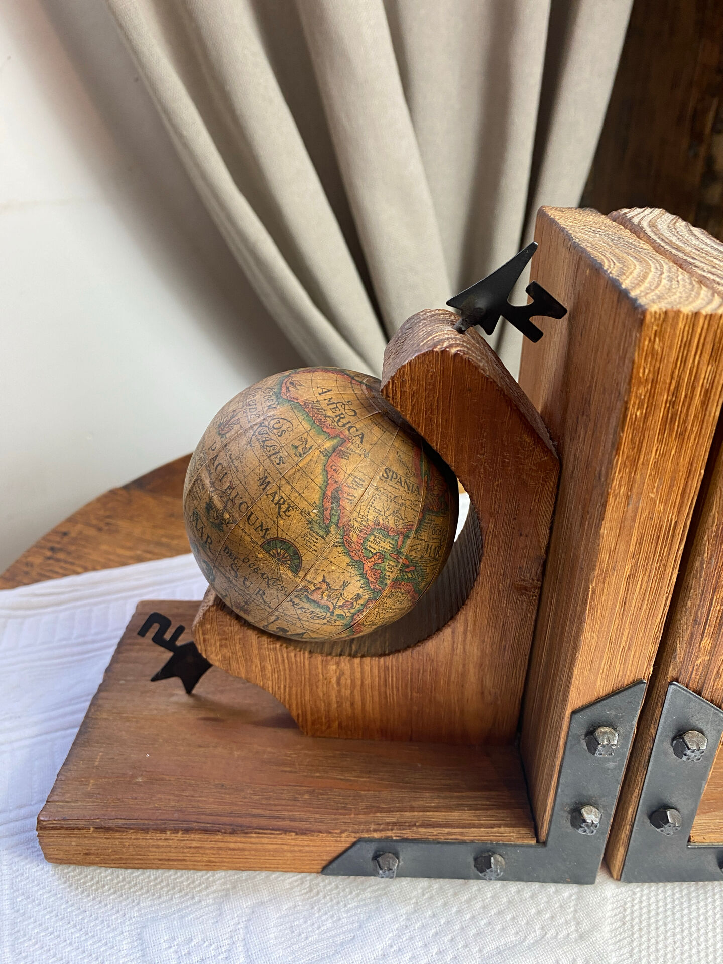 Pair of wooden bookends, rotating globes