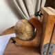 Pair of wooden bookends, rotating globes