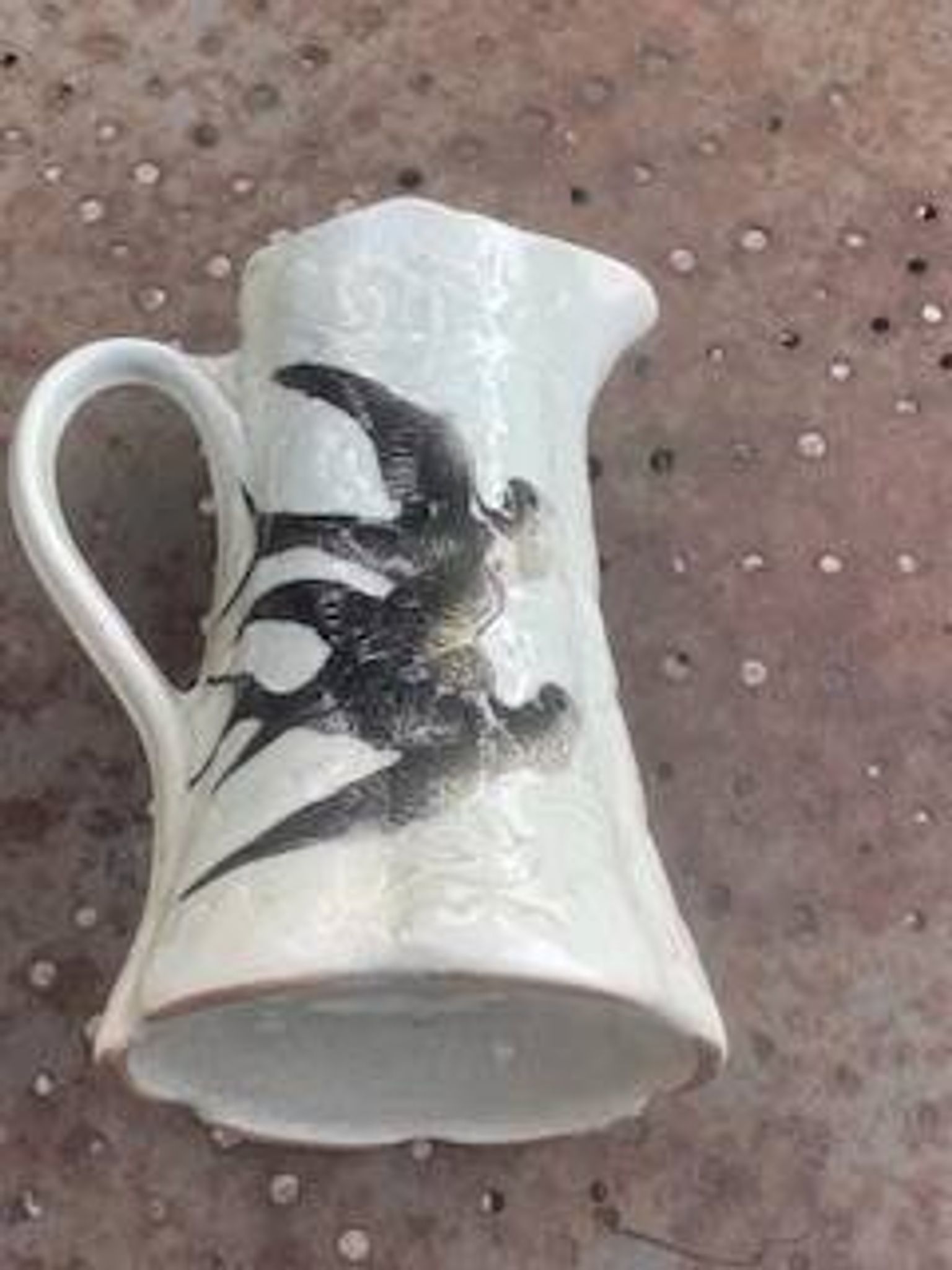 Jade green ceramic barbotine vase with swallows.