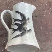 Jade green ceramic barbotine vase with swallows.