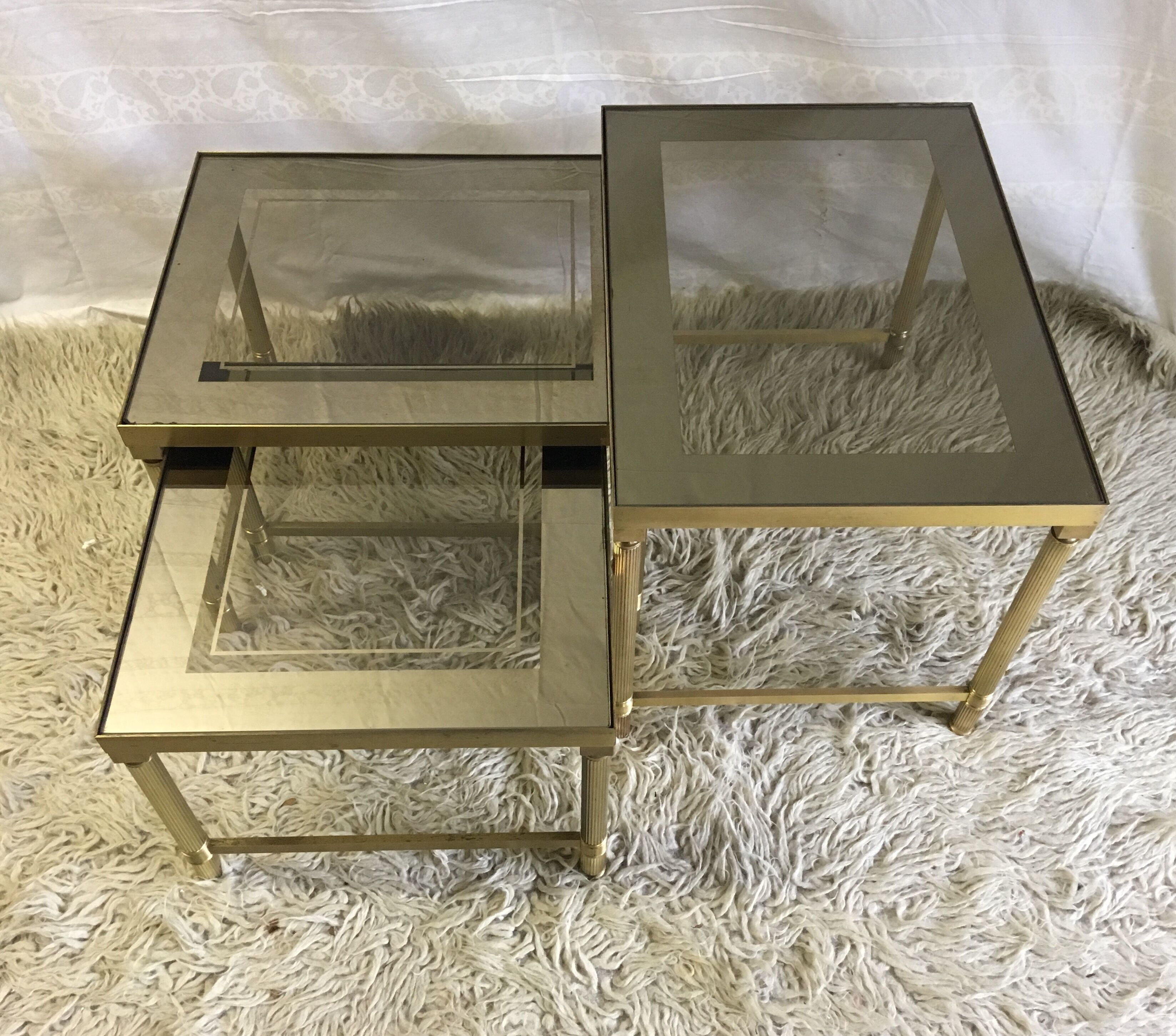 Brass and glass pull out tables 70