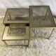 Brass and glass pull out tables 70