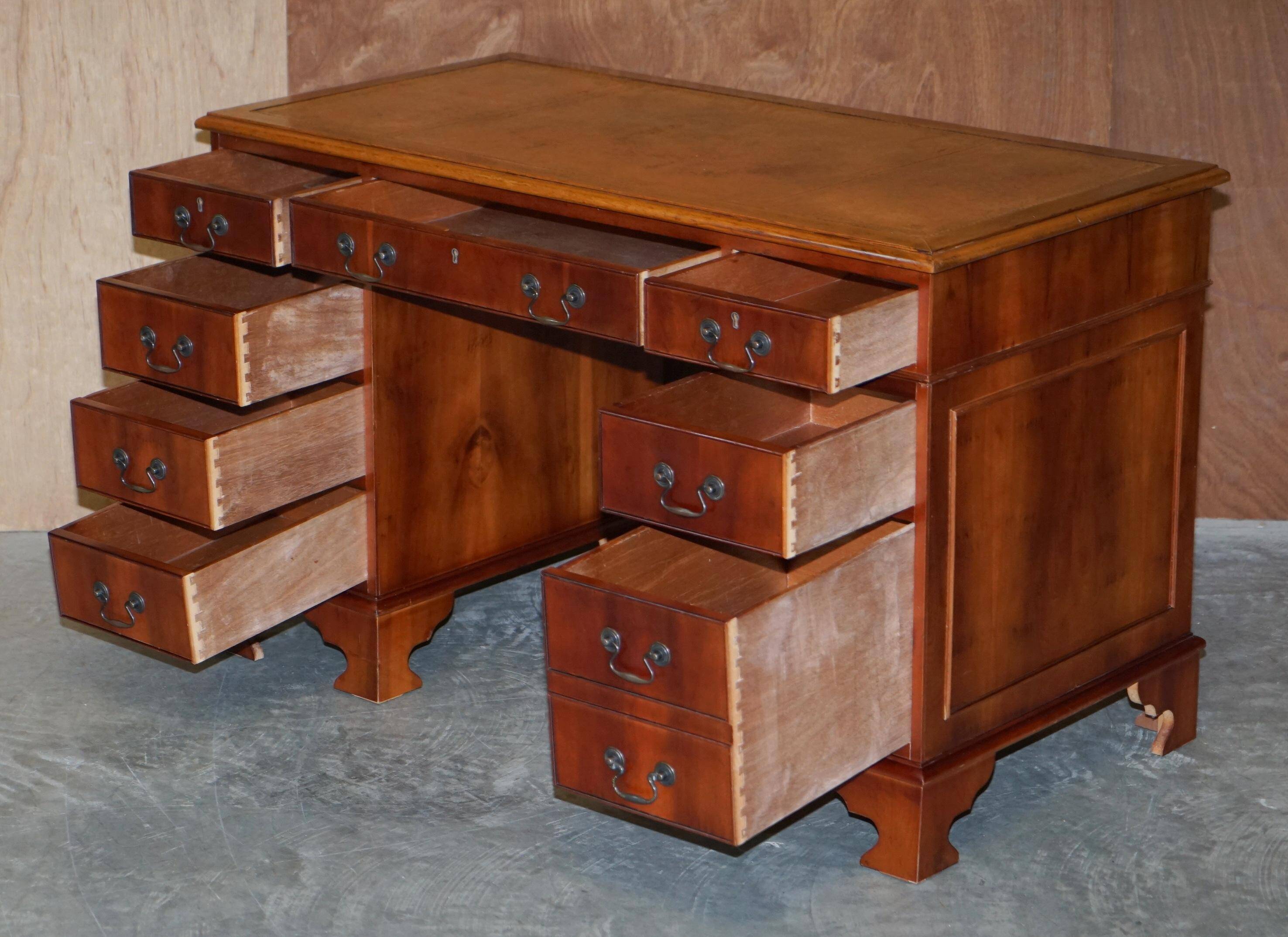 Vintage walnut desk with a leather top and two drawers.