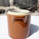 Trio of stoneware pots with lids
