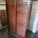 Double curtain binder in blond mahogany