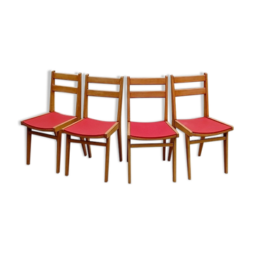 Vintage chairs from the 1950s in wood and faux leather.