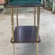 Brown rosewood rolling table with gold legs