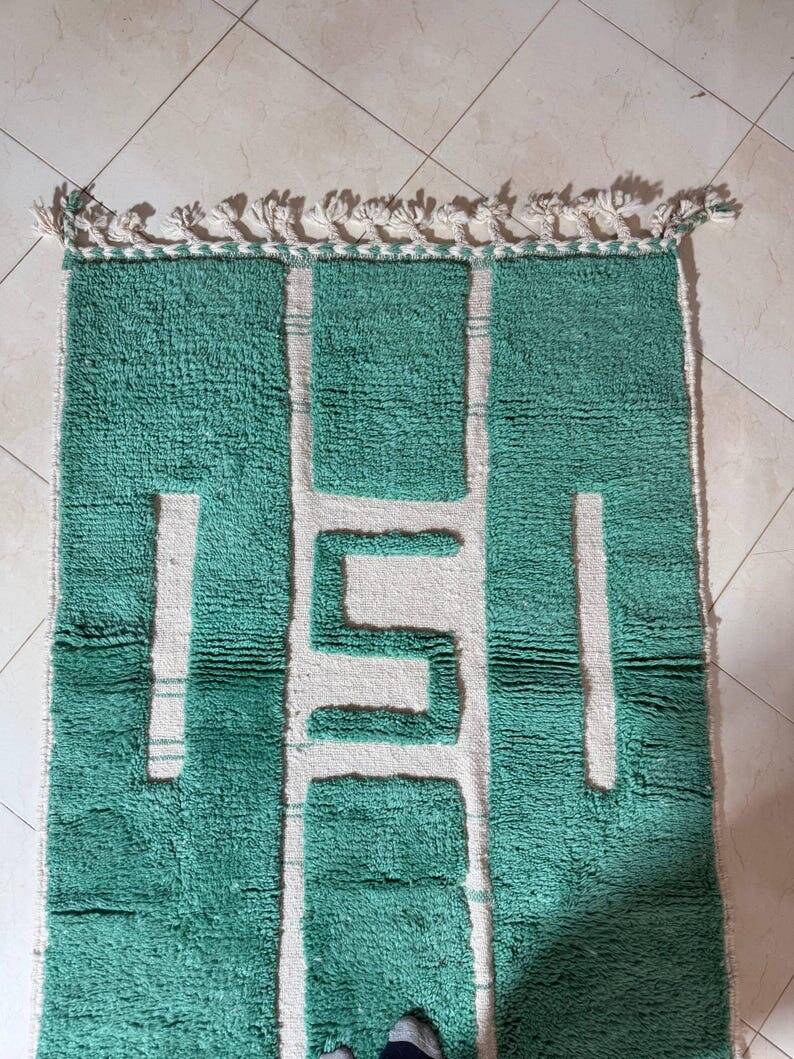 Beni Ourain Berber rug made of natural wool, traditionally handwoven.