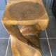 Stool n2 in solid raw walnut wood carved from the mass 1970