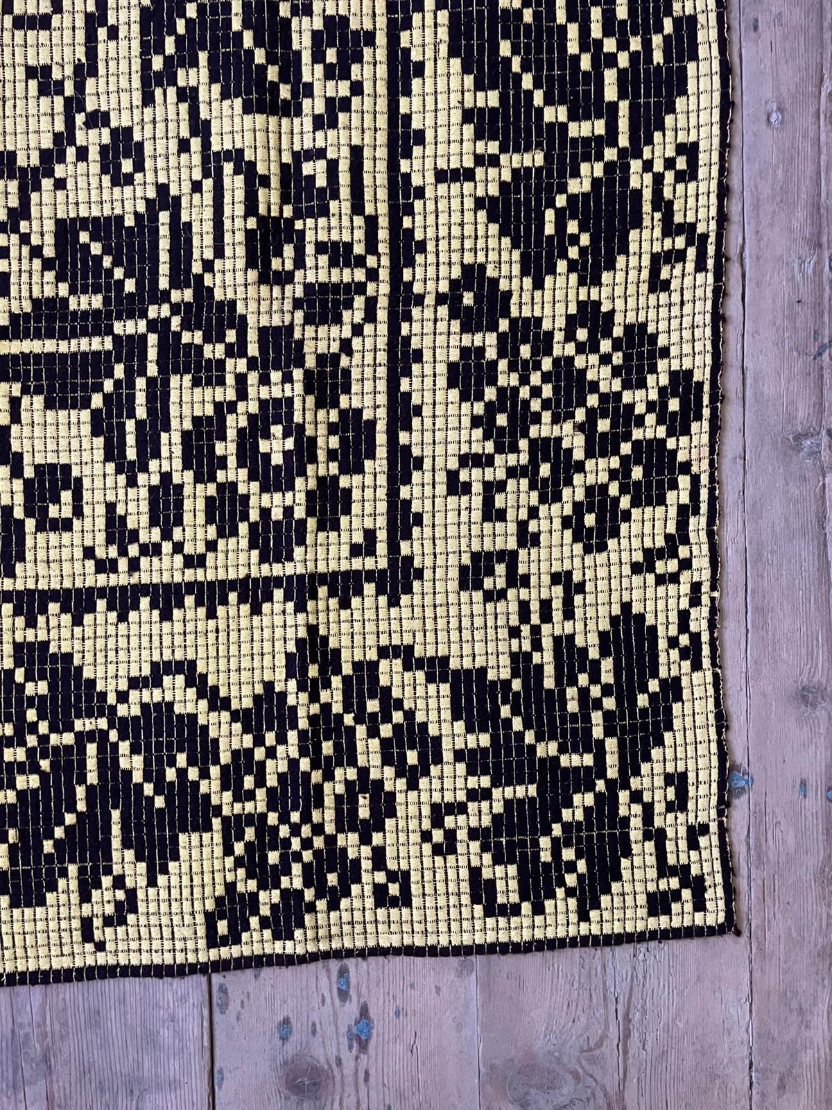 Romanian floral rug handwoven in wool, yellow and black background
