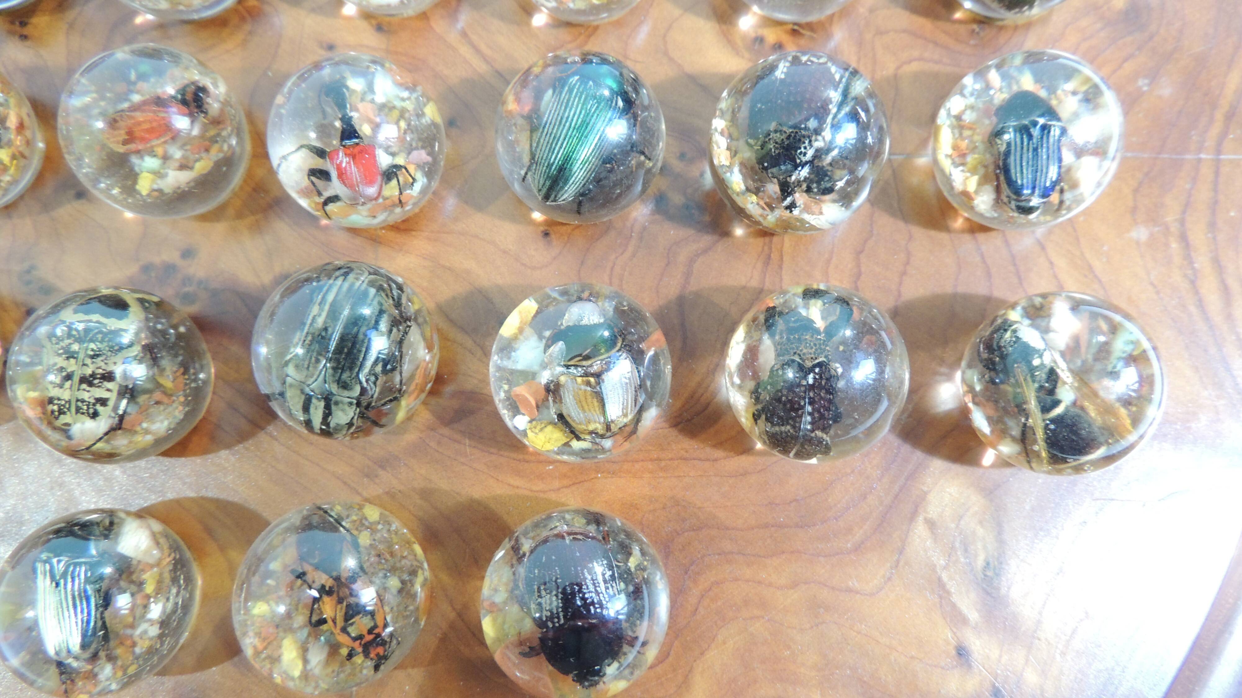 Vintage wooden solitaire game with resin balls and insects – Madaga