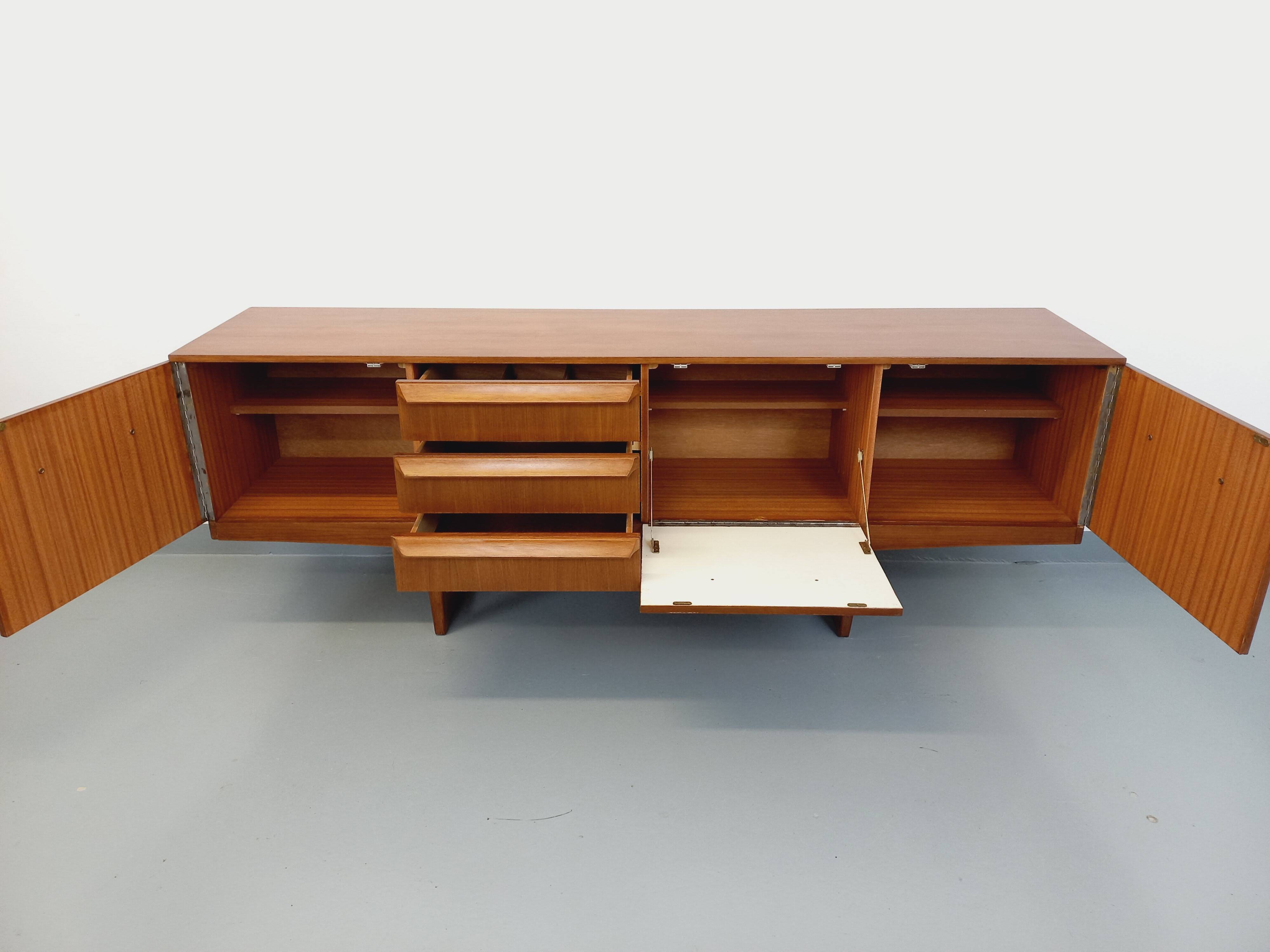 Vintage Scandinavian style sled foot sideboard in teak from the 60s