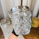 Seau à champagne en verre taillé et inox