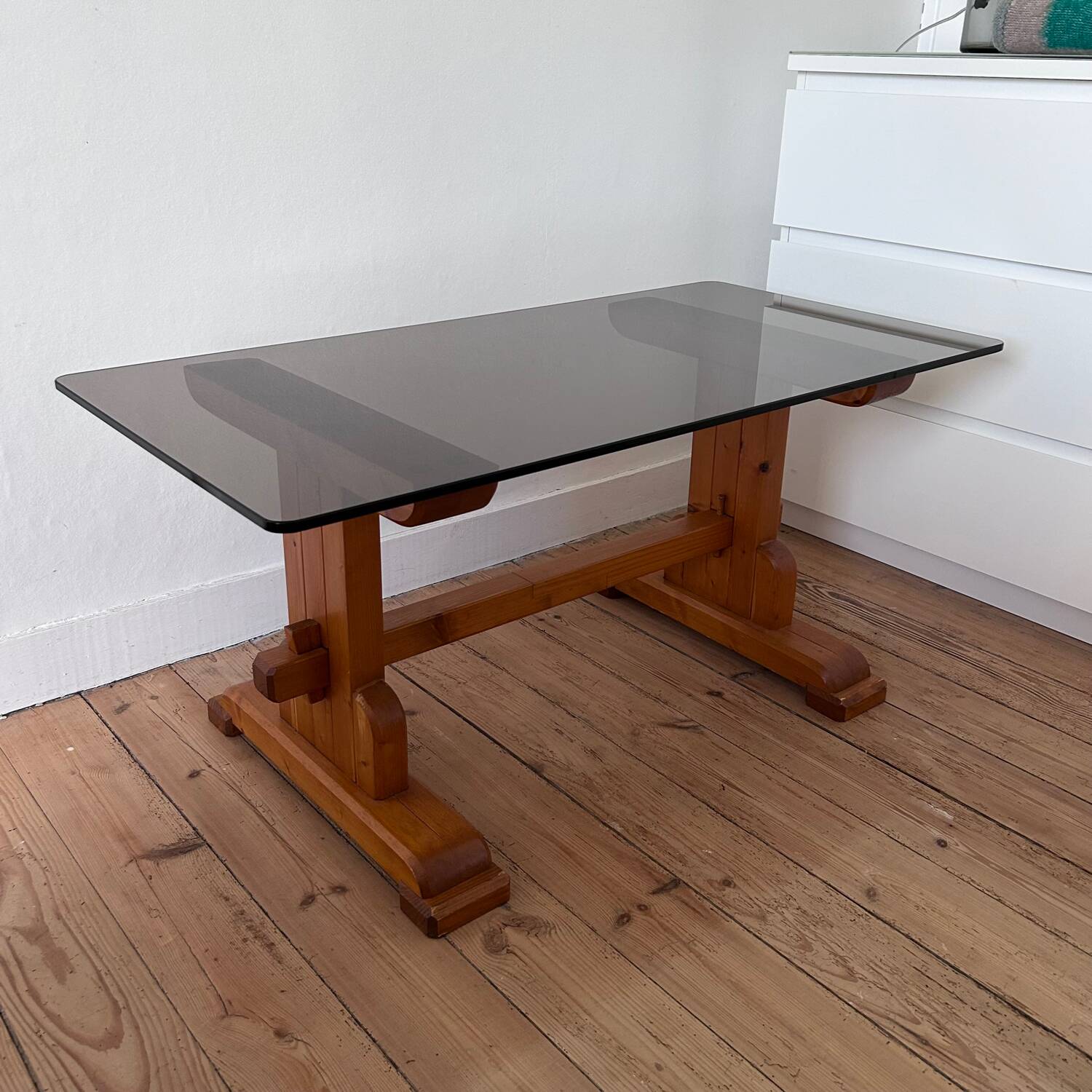 Pine coffee table with smoked glass top.