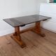 Pine coffee table with smoked glass top.