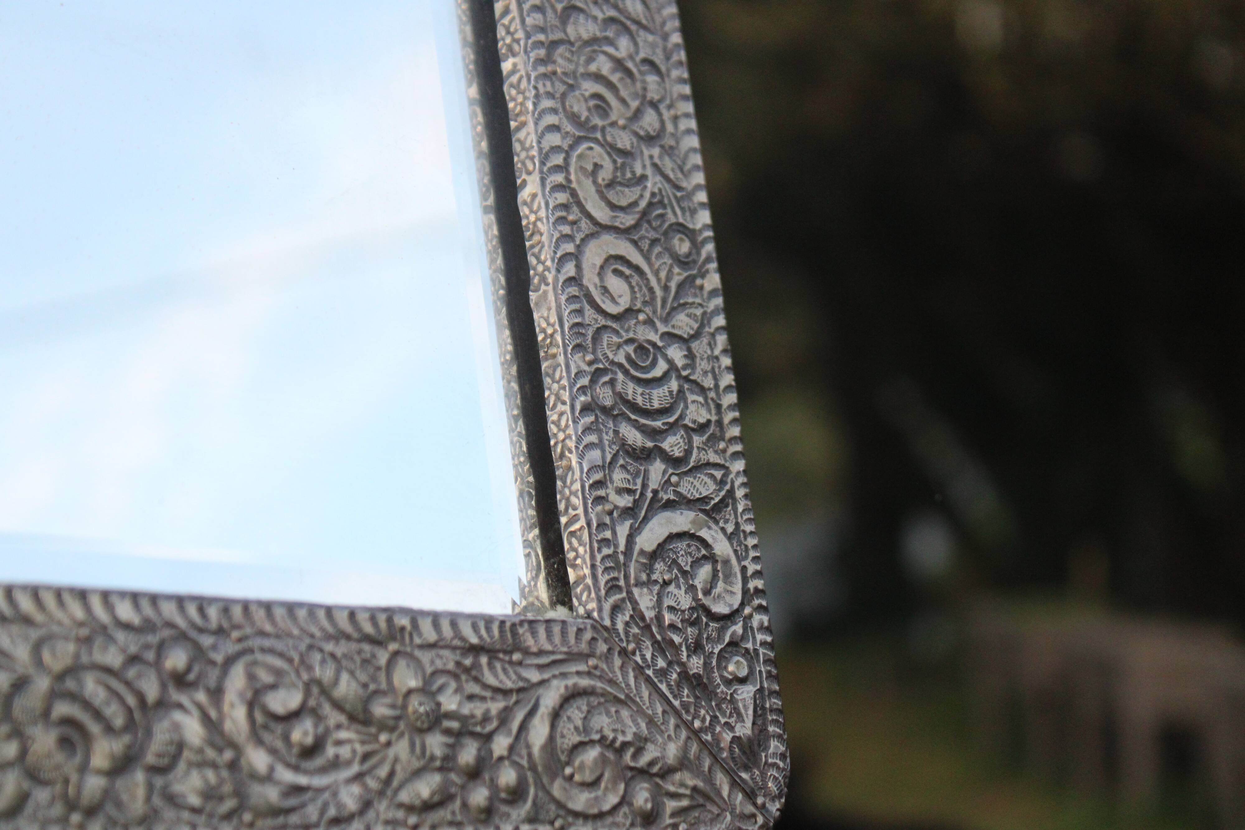 Oriental mirror in chiseled metal – beveled, for placing on a surface or hanging