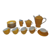 Vintage coffee service in Limoges porcelain, yellow-orange color