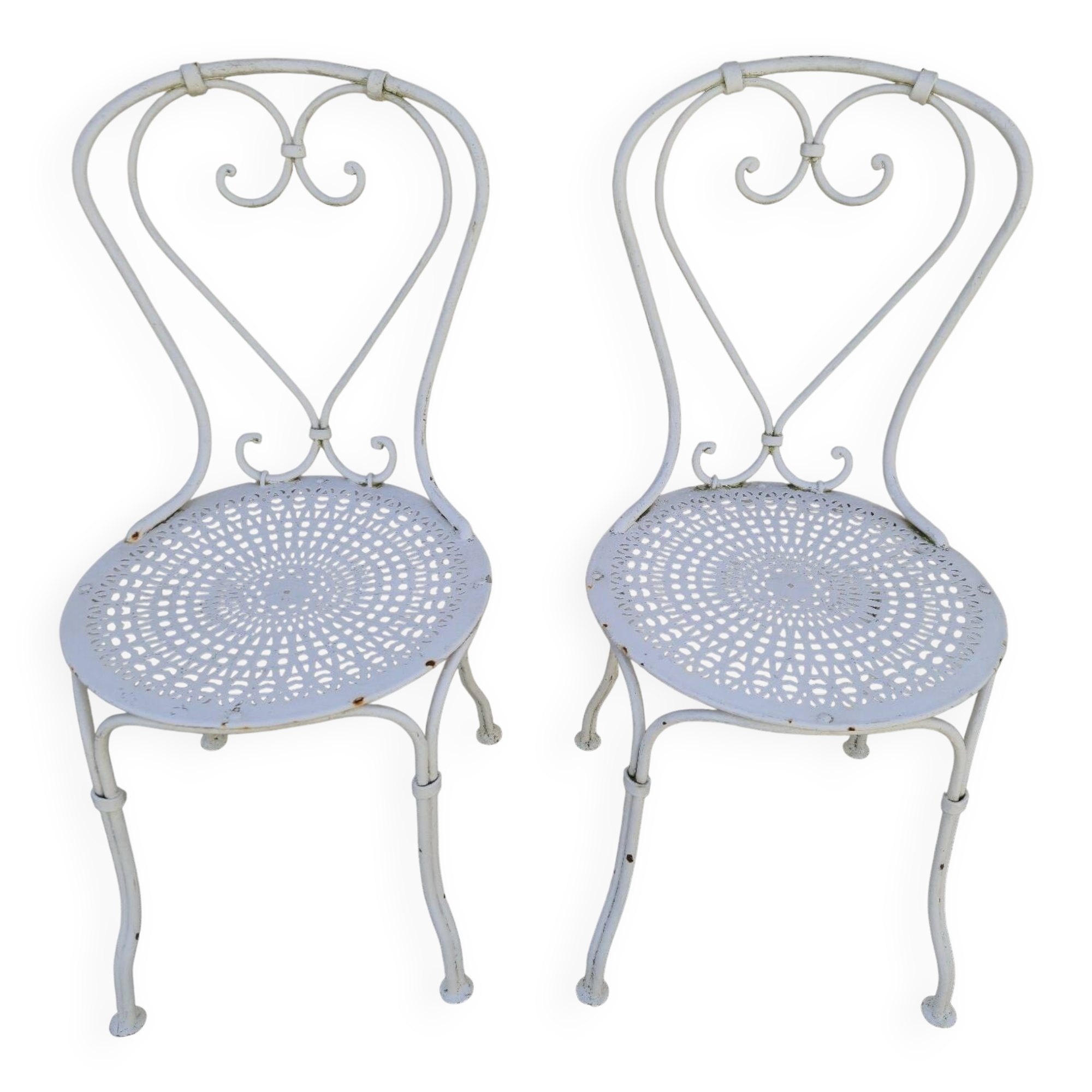 Pair of wrought iron garden chairs, antique manufacture